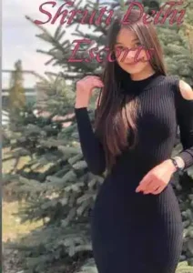 1 Girl wearing a black full dress getting her photo taken near the trees Parmote Escort Service in Delhi