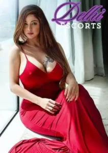 1 fat girl is sitting wearing a red full dress. Personal Companion in Delhi